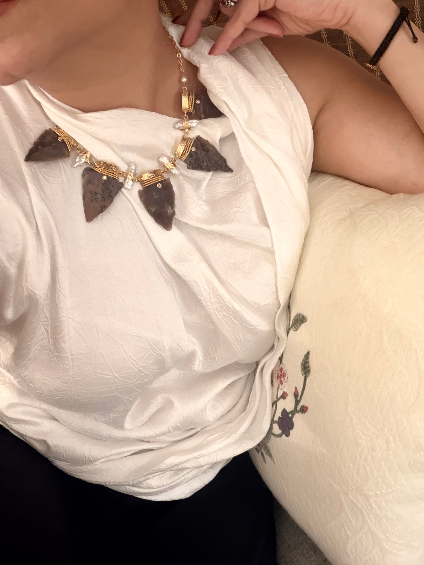 Arrowhead stone and pearl necklace